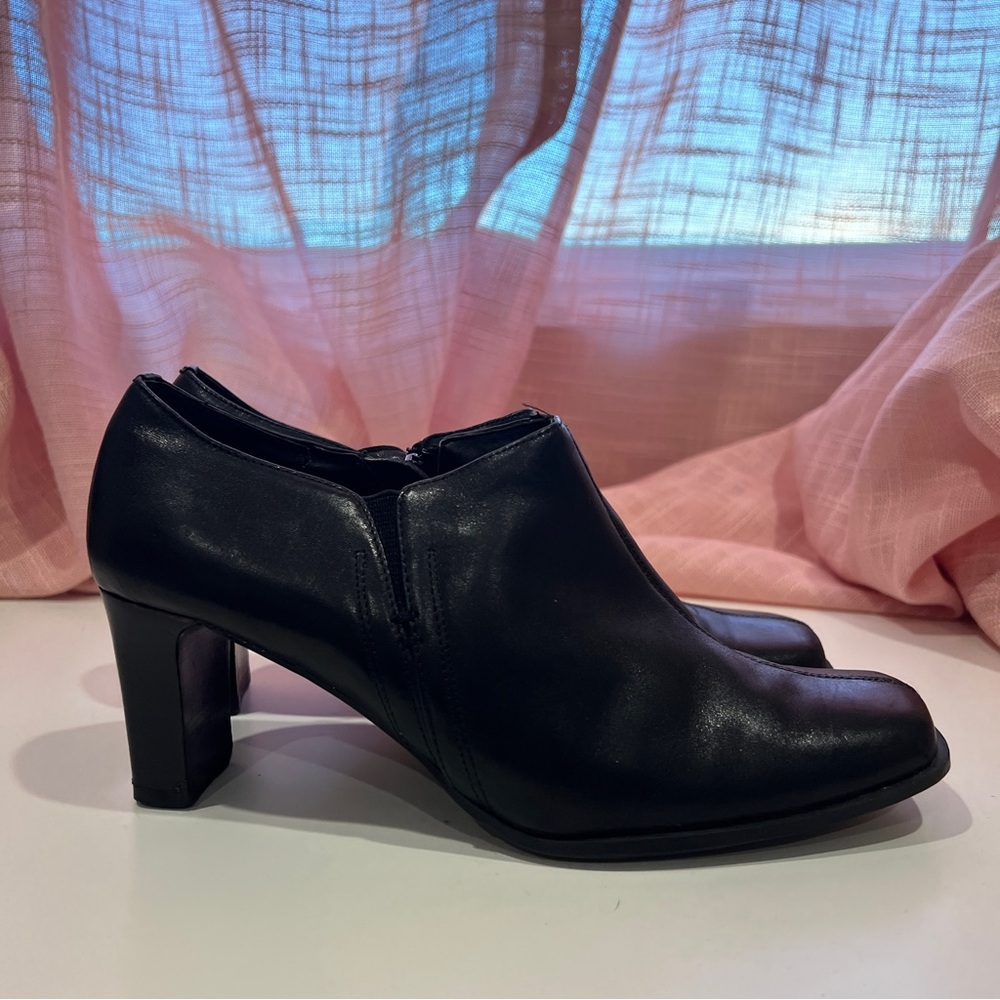 Black leather booties by Hilliard&Hanson.